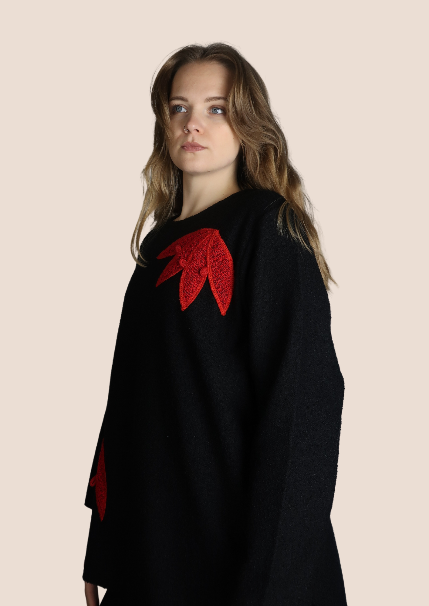 Black jumper with red flowers